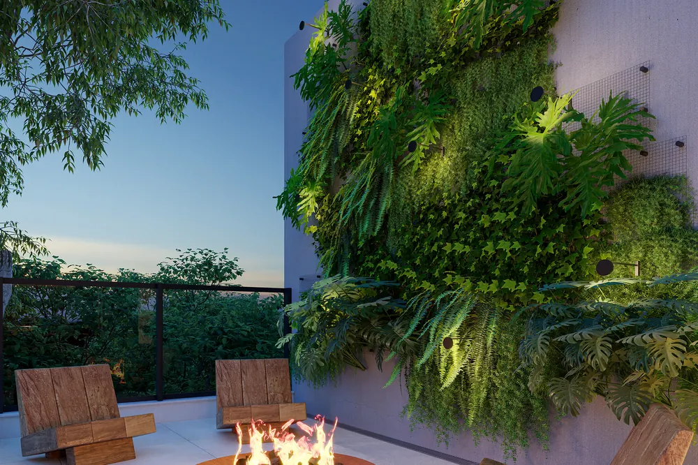 Lounge ao ar livre do terraço do Casa Mariana Loft Residencial com fire pit e jardim vertical